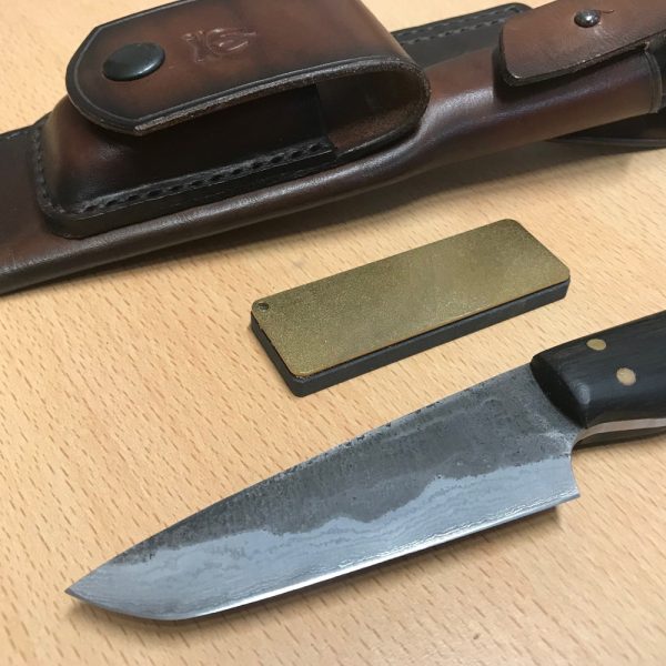 Blenheim Forge Bush Craft Knife along with English leather hand stitched sheath and Diamond/stone sharpener.