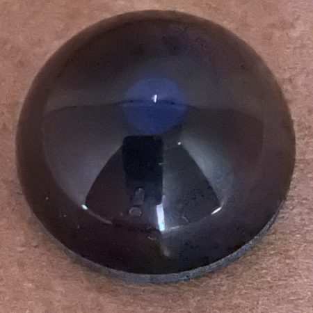Multi coloured Dog eyes with a round blue glint pupil